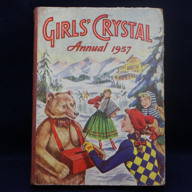 Vintage 'Girls' Crystal Annual 1957' with a bear and children illustration on a dark background