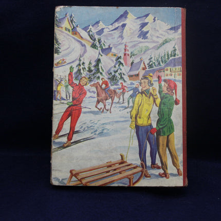Book cover with winter scene illustration of people skiing and sledding.