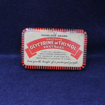 Moorland Brand Compound Glycerine of Thymol Pastilles packaging on a blue textured background