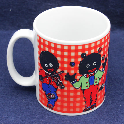 White mug with red checkered pattern featuring black figures on a blue background