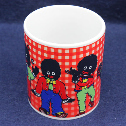 Mug with Golliwog characters on a red checkered background