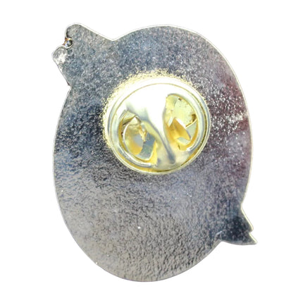 Metallic Guinness pin rear with a gold claspe  on a white textured background