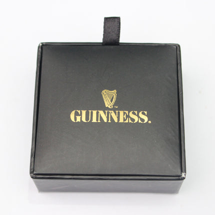 Black box with gold Guinness logo on a white background