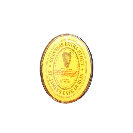 Gold Guinness label on a textured blue background