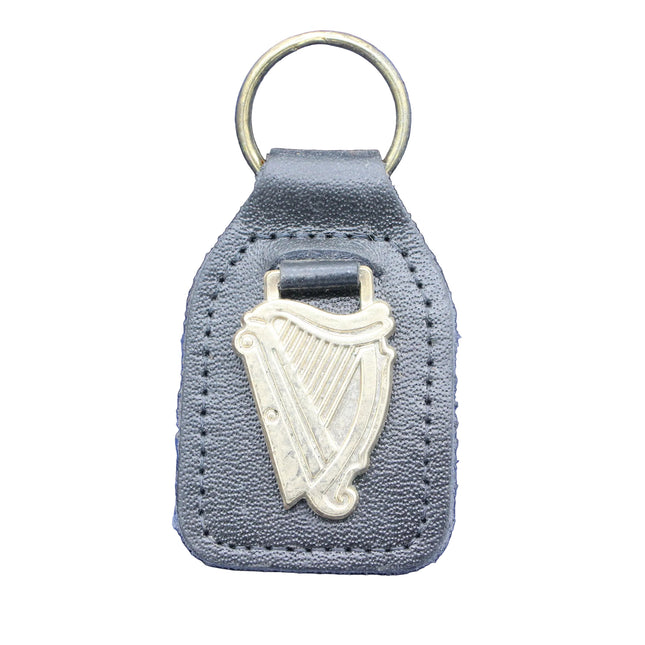 Keychain with harp design on a blue fabric background