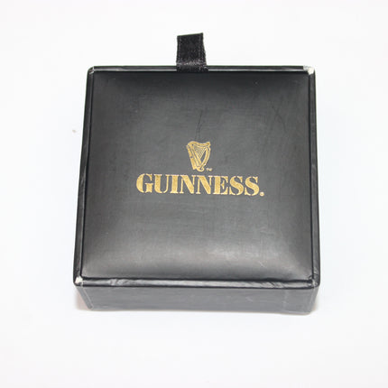 Black leather wallet with gold 'Guinness' logo on a white background