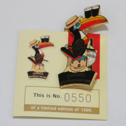 Pin with toucan design on a card with limited edition information