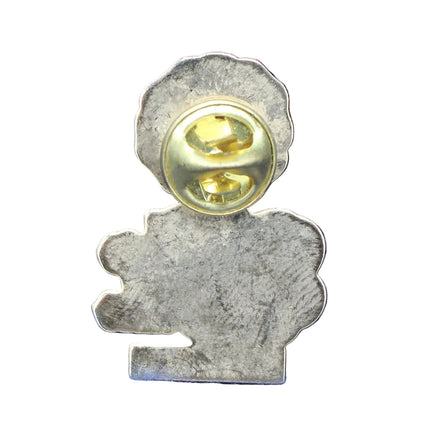 Metallic pin with a gold center on a blue textured background