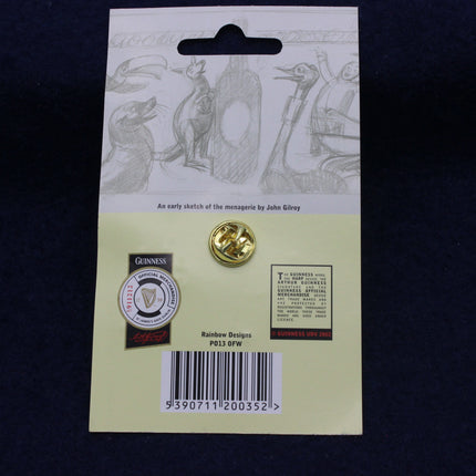 Gold pin on a card with Guinness branding and design details