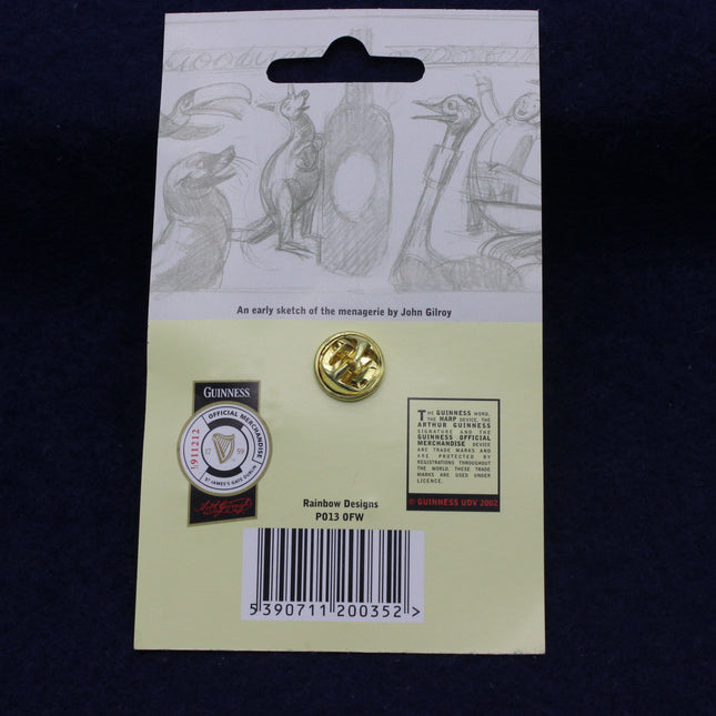 Gold pin on a card with Guinness branding and design details