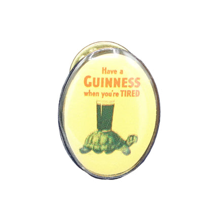 Pin with Guinness advertisement on a blue textured background