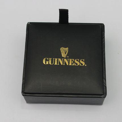 Black jewelry box with gold 'Guinness' logo on a white background