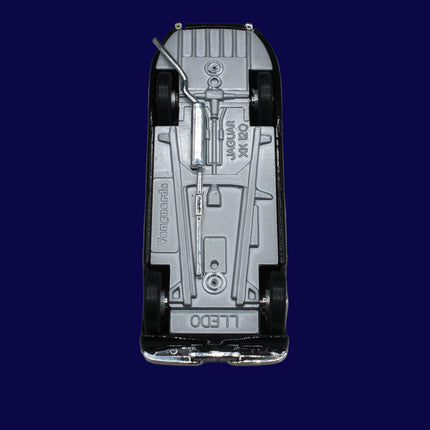 Top view of a Jaguar XK120 model car on a gray background