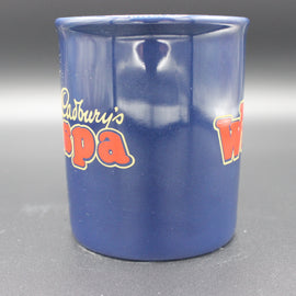 Blue mug with Cadbury's Wispa branding on a gray background
