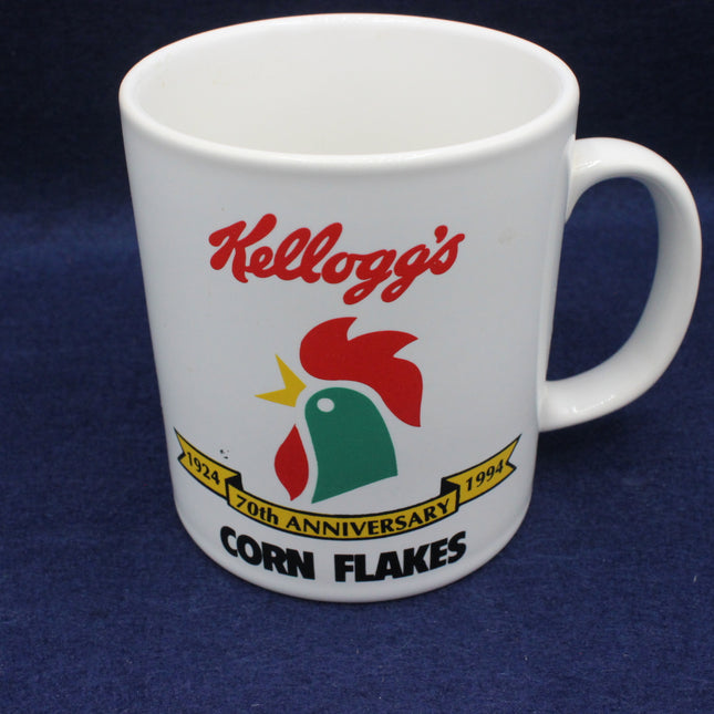 White mug with Kellogg's Corn Flakes logo on a blue background