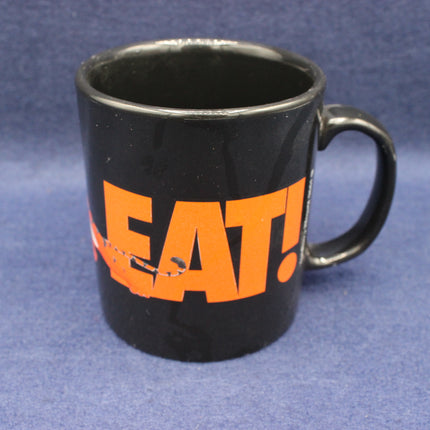 Black mug with orange text 'GREAT!' on a blue background