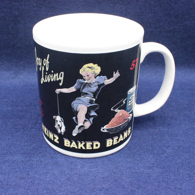 Mug with vintage-style design featuring a woman, dog, and can of Heinz Baked Beans on a blue background