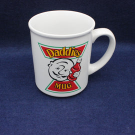 White mug with 'Daddies Mug' design on a blue background
