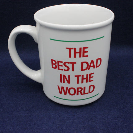 White mug with 'The Best Dad in the World' text on a dark blue background