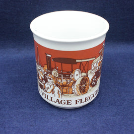 Mug with vintage vehicle design and 'Village Fleggburgh' text on a blue background
