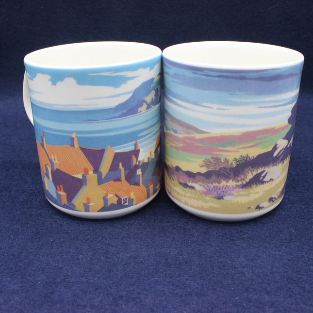 Two ceramic mugs with scenic designs on a blue background