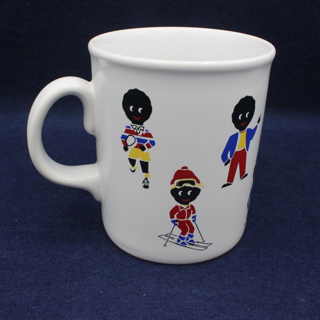White mug with golly figures in colorful outfits on a dark blue background