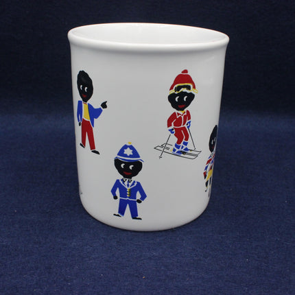 White mug with colorful illustrations of golly's on a dark blue background