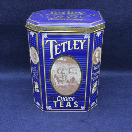 Blue Tetley tea tin on a dark blue background