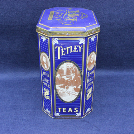 Hexagonal Tetley tea tin on a blue background