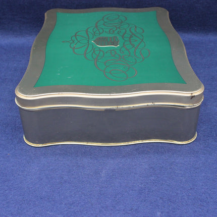 Decorative box with green top and black sides on a blue background