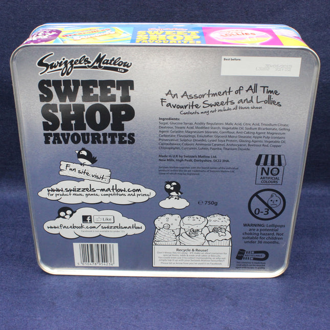 Back of a Swizzles Matlow Sweet Shop Favourites tin on a blue background