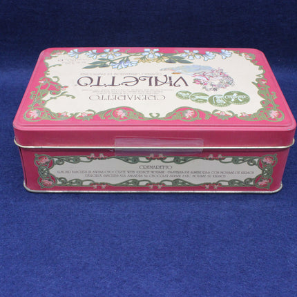 Decorative tin box with floral design and 'Vivette' branding on a blue background