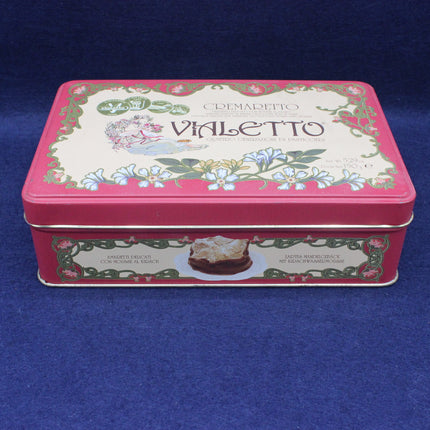 Decorative tin box with 'Vailetto' branding on a blue background