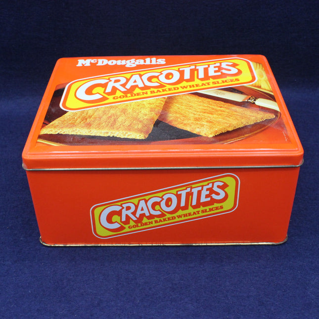 Red tin box of McDougall's Cracottes crackers on a blue background