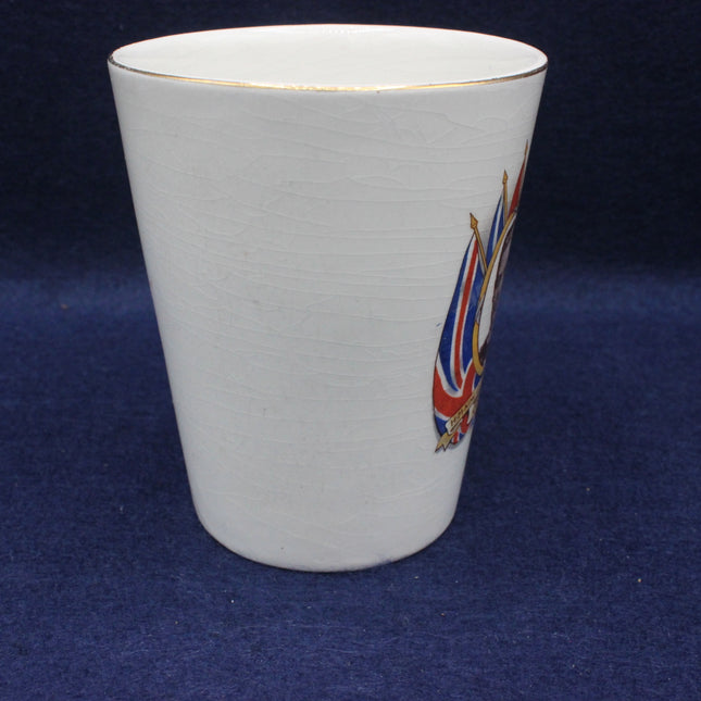 White ceramic cup with a Union Jack design on a blue background