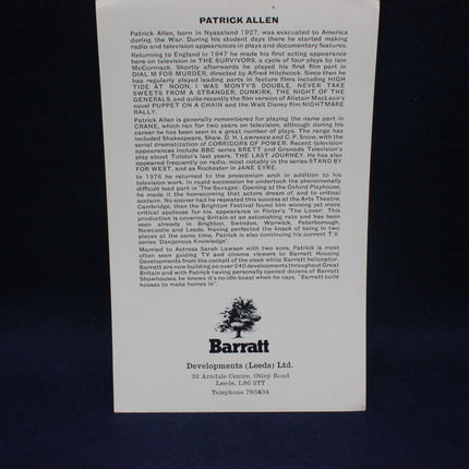 Back of a book or magazine with text and a logo on a black background