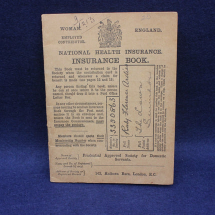 Vintage National Health Insurance book from England on a blue background