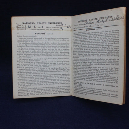 Open book with text on National Health Insurance on a dark background