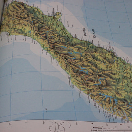 Topographic map of South Island, New Zealand with a grid background
