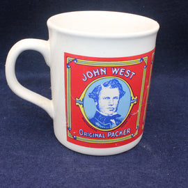White mug with John West branding on a dark blue background