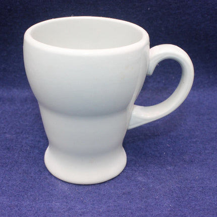 White ceramic mug on a blue background