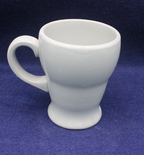 Green Dudson 1960 ceramic mug on a blue background