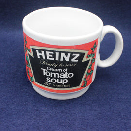 White mug with Heinz Cream of Tomato Soup label on a blue background