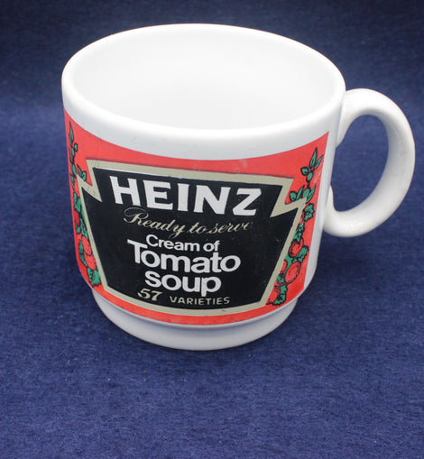 White mug with Heinz Cream of Tomato Soup label on a blue background