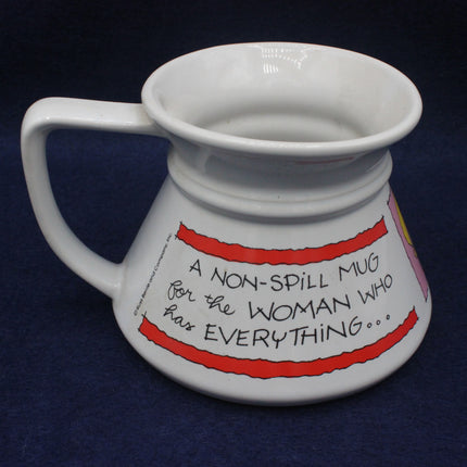 White mug with text on a dark blue background