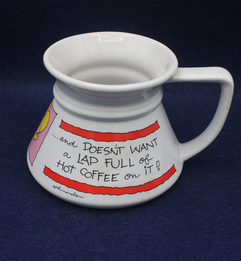 White mug with colorful design and text on a dark blue background