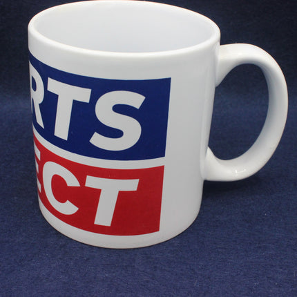 White mug with blue and red logo on a dark blue background