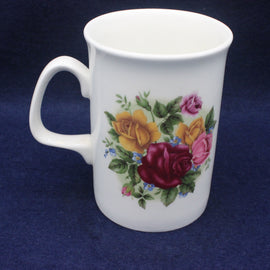 White mug with floral design on a blue background
