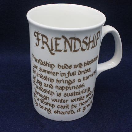White mug with brown text on a dark blue background
