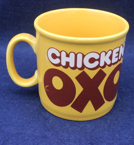 Yellow mug with 'Chicken Oxo' text on a blue background